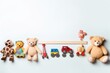 a top vie flat lay background border of children's or pet's toys stuffed animals and miniature cars on a pastel off-white background with negative copy space