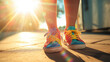 Kid feet wearing colorful summer shoes with sun rays