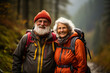 © Valeriia - Portrait shot of smiling senior couple taking selfie on mobile, smartphone while traveling in forest or calling their friends, relatives while hiking with backpacks. Elderly healthy life concept