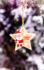 Wall Mural - Merry Christmas greeting on the snow-covered branches of spruce
