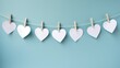 garland of white paper hearts on clothespins, on a blue background. concept of valentine's day, february 14, lovers, hearts, relationships