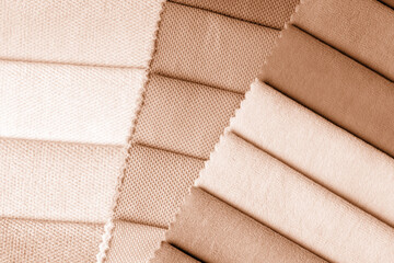 Wall Mural - a variety of fabrics with a color palette. New trending PANTONE Peach Fuzz color of 2024 year