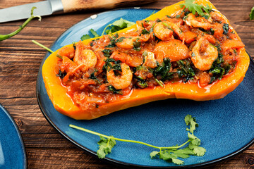 Wall Mural - Baked pumpkin stuffed with vegetables and shrimp.