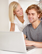 © Tabitha Rose/peopleimages.com - Laptop, smile and planning with a young couple in their apartment for research or investment together. Computer, bank or ecommerce with a happy man and woman in their home for growth or development