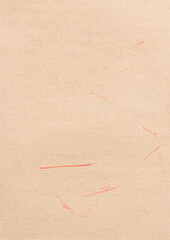 Bright brown paper with red pencil marks