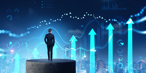 Poster - Man looking at financial diagrams in night city sky