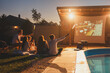 © Impact Photography - Friends celebrating birthday in an open air cinema waving with sparklers