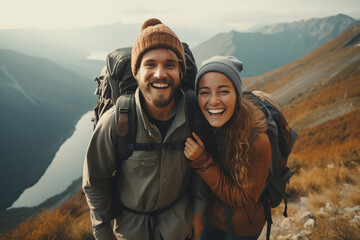 happy couple hiking and having fun in the mountains.