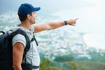 Poster - Outdoor, hiking and man with nature, pointing and adventure with direction, journey and fitness. Person, hiker and guy with wellness, travel or location with fresh air, forest or landscape with view