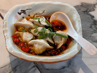 Wall Mural - spicy and sour dumpling in bowl