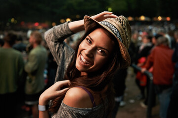 Canvas Print - Happy woman, portrait and night at music festival party, event or outdoor DJ concert. Face of female person smile with hat in evening crowd or audience at carnival, performance or summer fest outside