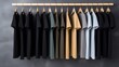 © Yahor Shylau  - T-shirts hang neatly on a hanger.