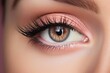 Beautiful macro shot of female brown eye make up with peach fuzz eyeshadows
