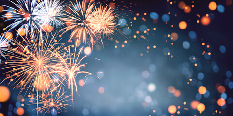 Wall Mural - gold and blue fireworks and bokeh in new year eve and copy space. abstract background holiday.