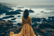 woman looking at the sea in solitude. Concept of melancholy and loneliness.