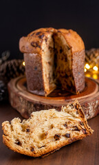 Wall Mural - Slice of delicious Panettone with chocolate for Christmas. On wooden table