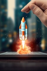 Wall Mural - a hand holding a tablet with a rocket emerging from the screen. perfect for technology, innovation, 
