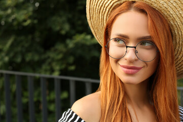 Sticker - Portrait of beautiful woman in glasses outdoors. Space for text