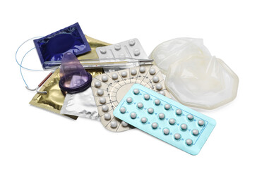 Contraceptive pills, condoms, intrauterine device and thermometer isolated on white. Different birth control methods