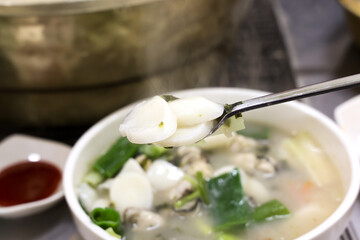 Korean food. oyster rice cake soup