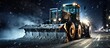 A snow removal service spreads rock salt on a city road at night during a winter blizzard using a Tractor with a mounted salt spreader.