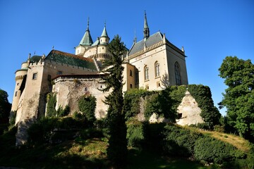 Wall Mural - View from behind the trees of the old walls castle Bojnice Slovakia