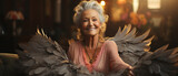 Fototapeta  - Engelsanmut: Schöne Seniorin mit himmlischen Flügeln