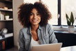 © imagemir - Happy black woman working in home office. A relaxing work day