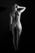 © Сергей Луговский - Low key portrait of naked slender woman from the back in black and white