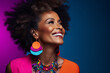 Mature young dark skin woman with black afro hair isolated in minimal background, happily smiling black woman wearing fancy jewelries and colorful cloths side face close up portrait, healthy skin care