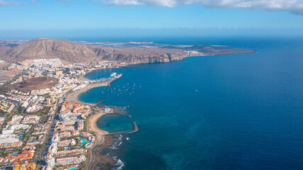 Aerial photo from drone to de Tenerife and beachs Adeje Playa de las Americas, Playa Honda,Playa de Troya, Playa de El Bobo.In the background Tenerife at sunset. Tenerife, Canary islands, Spain