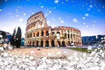 Wall Mural - Colosseum of Rome dawn snow view, famous landmark of eternal city winter view