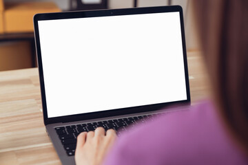 Fototapete - Woman hand type on the keyboard on laptop with mockup of blank screen for the application.