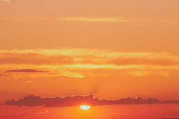 Wall Mural - The yellow and orange colors of the sunrise sky were reflected in the clouds, creating a stunning dawn landscape.