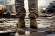 Soldier legs in military camouflage in army boots