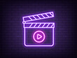 Outline neon clapperboard, violet pink icon. Glowing neon clapper board with play sign. Video production, cinema editor, movie shooting, music clip recording. Filmmaking studio, multimedia editor