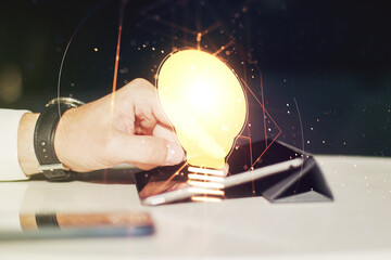 Poster - Creative light bulb illustration with finger presses on a digital tablet on background, future technology concept. Multiexposure