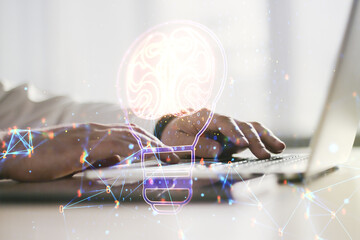 Poster - Creative idea concept with light bulb and human brain illustration and with hands typing on laptop on background. Neural networks and machine learning concept. Multiexposure
