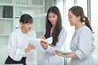 © DG PhotoStock - Group of young Asian businesspeople - employees discussing about the new product launch in team meeting.