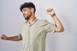 © Krakenimages.com - Arab man with beard standing over white background stretching back, tired and relaxed, sleepy and yawning for early morning