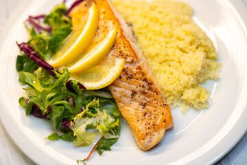 Canvas Print - salmon fillet with couscous and vegetables salad