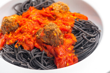 Wall Mural - black spaghetti with tomato sauce with meat balls