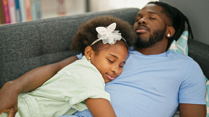 Sticker - African american father and daughter lying on sofa sleeping at home