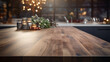 Kitchen wooden worktop with modern kitchen in blurry bokeh background. Wooden table interior design. Luxury kitchen