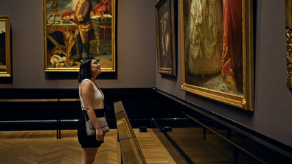 Wall Mural - Young beautiful hispanic woman visiting art gallery at Art Museum in Vienna