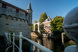 Fototapeta Tulipany - Dutch Draw Bridge and medieval fortifications of a water gate with passage to inner harbor in old village Zierikzee