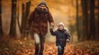 © Elchin Abilov - In the autumn forest, the father and son are enjoying themselves while looking happy and sincere.