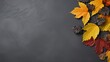 © Akbar - A flatlay copy space for thanksgiving day concept flatlays with colorful leaves on a gray background in autumn composition.
