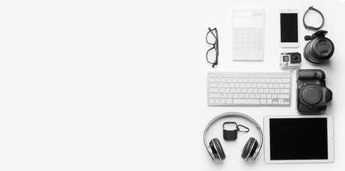 Wall Mural - different modern devices, gadgets and eyeglasses on white background with space for text