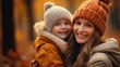 © Tahir - A young mother and her young daughter are enjoying the autumn season in a park.